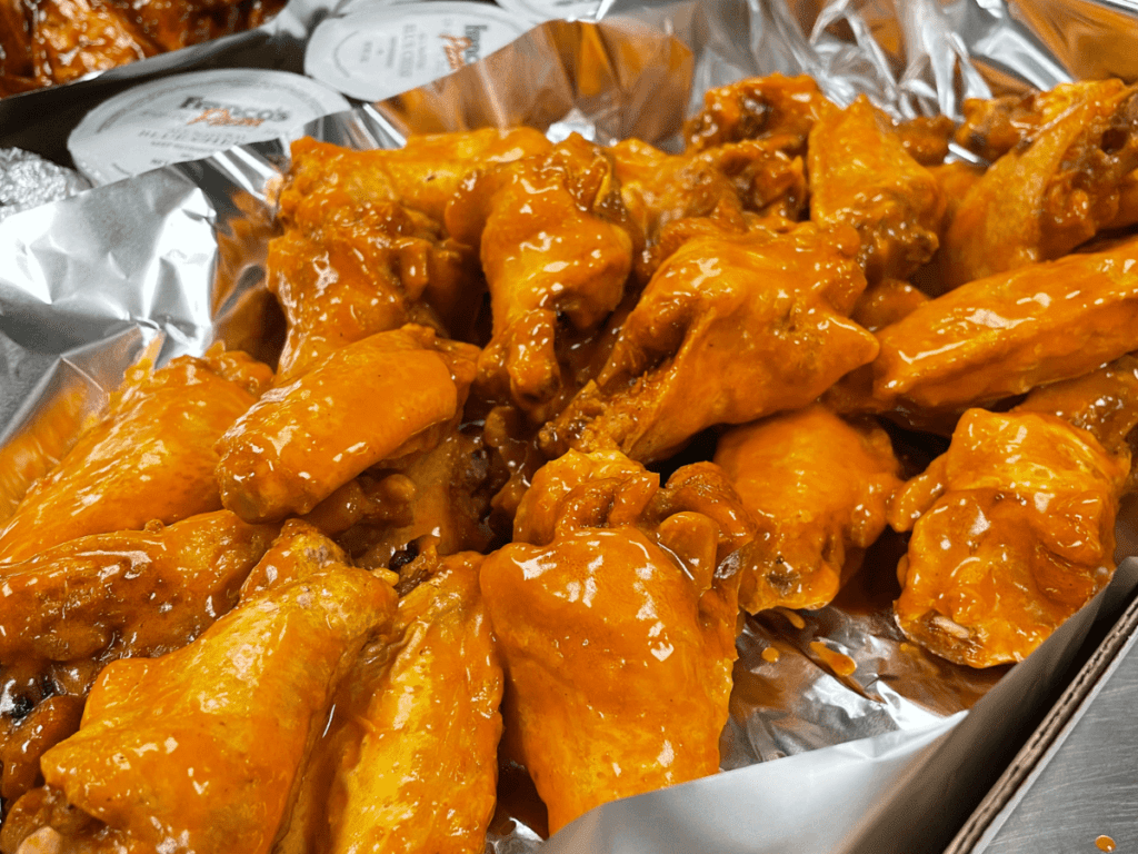 chicken wings coated in traditional buffalo sauce